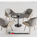 Modern Round Black Table with Four Gray Chairs Wooden Legs and Small Plant Set
