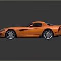 Orange Sports Car with Streamlined Body Black Roof and Shiny Wheels on Dark Background