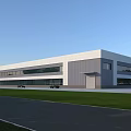 Modern Industrial Factory Building With Gray White Exterior Large Windows And Green Lawn Area