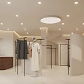 Modern Minimalist Clothing Store Interior Design With Mannequins Clothing Racks And Wooden Counter