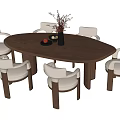 Oval Shaped Wooden Dining Table With Six Upholstered Chairs And Flower Vase