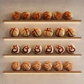 Neatly Arranged Fresh Artisan Bread Loaves on Wooden Shelves with Decorative Patterns