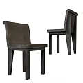 Modern Leisure Chair With Sleek Dark Frame And Upholstered Seat Design