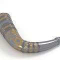 Gray And Gold Decorative Horn Musical Instrument With Intricate Ornate Patterns