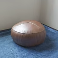 Round Brown Leather Stool Placed On Blue Carpet In Room Corner 3d model
