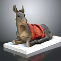 Detailed Donkey Sculpture Lying On White Base With Red Blanket