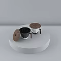 Black and White Ceramic Cups With Wooden Lids Handles On White Circular Display Stand