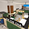 Tuk Tuk Cafe Interior With Blue Tuk Tuk Vehicle Green Plant Wall And Wooden Counter
