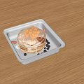 Stacked Pancakes With Mango Chunks Syrup And Blueberries In White Square Container