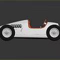 Vintage Silver Race Car With Orange Steering Wheel And Black Tires