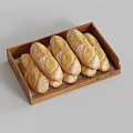 Fresh Flour Dusted Baguettes Arranged In Wooden Tray For