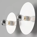 Modern White Round Wall Lamps With Transparent Bulbs Mounted On Gray Wall Emit Soft Light