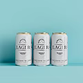 Three Studio Premium Lager Beer Cans on Light Blue Background 3d model
