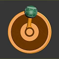 Red Cylindrical Computer Accessory With Gold Trim And Green Knob For PC Setup