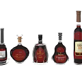 Elegant Assorted Wine Bottles And Glasses Display With Various Shapes And Labels