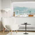 Cozy Beige Armchair With Small Round Side Table Camera Floor Lamp And Window Lake View