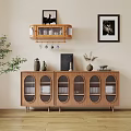 Wooden Sideboard with Glass Doors Decorative Items and Framed Art on Wall