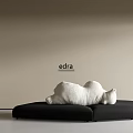 Edra Modern Sectional Sofa With Sculptural White Cushions And Black Frame