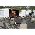 Outdoor Restaurant With Large Screen Outdoor Seating Plants And Wooden Tables