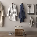 Bath Robes And Towels Hanging On Wall With Wicker Basket And Slippers