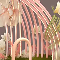 Floral Installation Design With Pink Arch White Pink Flowers Green Grass Decorative Steps And Silhouette Figure