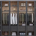 Organized Clothes in Modern Closet Featuring Hanging Garments Storage Cabinets Hats and Boxes