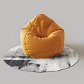 Yellow Plush Bean Bag Chair On Round Gray And White Rug
