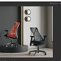 Two Red And Black Ergonomic Office Chairs With Mesh Design On Display Stand