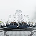 Garden Ornament Featuring Circular Fountain With Multiple Water Jets White Decorative Figures And Green Plants