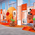 Orange Themed Exhibition Display With Photo Boards Text Content And Flower Decorations