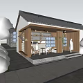 Traditional Style Commercial Street With Wooden Structure Outdoor Seating Greenery And People Relaxing