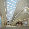 Modern Shopping Mall Interior With Glass Skylight Multi Level Walkways And Bright Storefronts