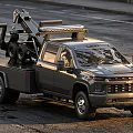 Chevrolet Gray Pickup Tow Truck With Heavy Duty Tow Equipment Parked On Asphalt Road
