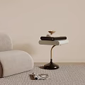 Modern Side Table with Light Gray Sofa in Living Room Featuring Stacked Books and Tray