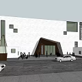 Modern Museum Building Featuring White Facade Geometric Windows Triangular Entrance People And Cars