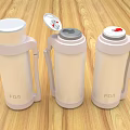 Three White Thermal Mugs With Different Lid Designs Handles On Wooden Tabletop