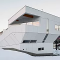 Modern Geometric Detached House With White Exterior Large Windows In Snowy Winter