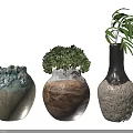 Three Decorative Vases with Green Plants Blue Green Textured Brown Ceramic and Black White Spotted