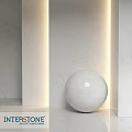 Elegant White Spherical Component On Marble Wall With Soft Lighting