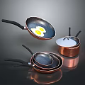 Copper Kitchen Cookware Set with Black Handles Stacked Frying Pans And Egg In Pan