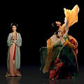 Traditional Chinese Female Performers In Elegant Costumes With Flowing Robes And Dance Movements