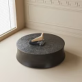 Round Black Coffee Table With Textured Surface Bird Decor And Black Book 3d model