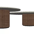 Light Colored Round Side Tables With Brown Ribbed Legs And Black Hole Design