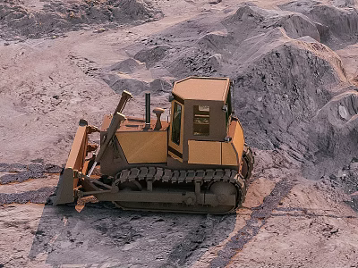 Yellow Bulldozer Operating in Mining Area with Rock Piles and Dirt Mounds 3d model