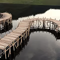 Wooden Boardwalk Structures With Curved And Straight Paths On Calm Water