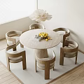 Modern Minimalist Round Dining Table With Wooden Chairs And Lemons On Tabletop