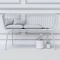 Rose Gold Frame Two-Seater Sofa With Grey Cushions Beige Pink Pillows And Green Plants In Grey Pots