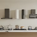Modern Kitchen Appliances Featuring Wall Mounted Range Hood Stove Oven And Cookware On Countertop
