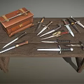 Vintage Leather Case And Multiple Daggers On Rustic Wooden Table 3d model