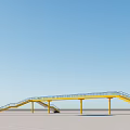 Scenic Yellow Bridge With Water Tower Against Clear Blue Sky On Sandy Ground